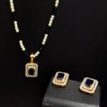 Two tone Pendant set with pearls String Rhodium plated 925 Silver With blue sapphire and Zircons.
