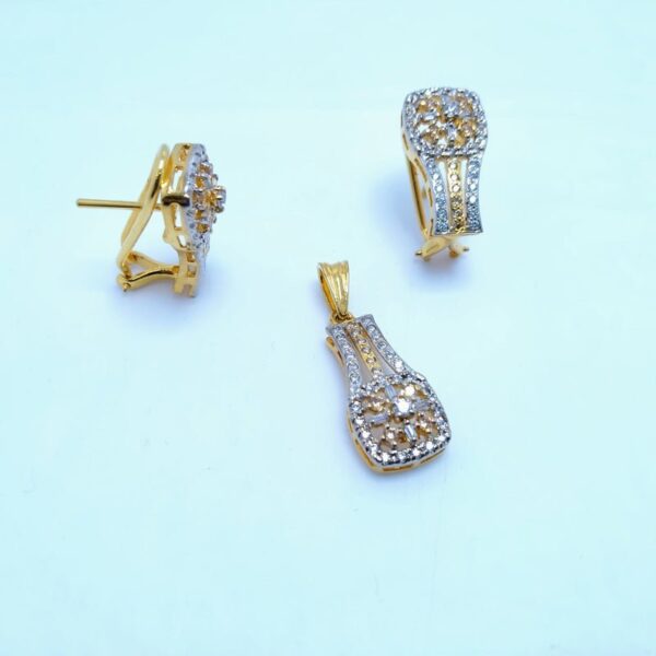 silver pendant set with zircons and gold plated.